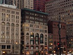 a city street filled with lots of tall buildings