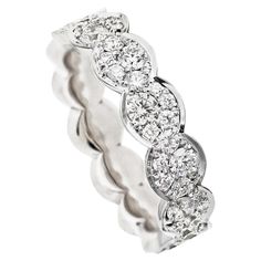 Mosaic set Diamond Eternity Stacking Ring, handmade in Belgium by jewellery artist Joke Quick. patiently set with white DEGVVS brilliant-cut diamonds 0.78 ct. in different sizes. The ring is set with diamonds up to just over halfway. 18K White gold 5.3 gram. White DEGVVS brilliant-cut diamonds 0,78 carat. Size EU 54 US 6 3/4 This ring can be custom made with a different color gold, other color gemstones or fancy color diamonds. Dimensions: Width: 5.14 mm. / 0.202 inch ; hight : 1.7 mm / 0.069 in Artist Joke, Rings Diamond, Eternity Ring Diamond, Diamond Eternity, Fancy Color Diamonds, Stacking Ring, Artistic Jewelry, Ring Handmade, Bridal Rings