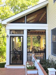 a small white house with an open porch