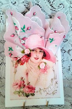 a pink hat with flowers on it