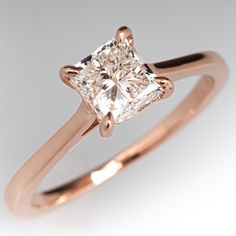 a rose gold ring with a princess cut diamond