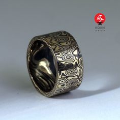 "These are unique mokume gane forged wedding or engagement rings, made of 14K rose gold, 18K yellow gold and sterling silver (oxidized). Can be ordered in pair as well as separatly up to your preferences in size, width, thikness and design. They are 100% handmade forged. The price will depend on final weight of the rings.  Koan mokume gane jewellery My name is Andrew Seginovich, designer, maker and creator of Koan Mokume gane Jewelry. Welcome to my shop! The studio was created in 2005, and since that time I've been seeking the most interesting, inspiring and beautiful designs to make you happy. I hope you will enjoy my work and I promise to do my best to make you satisfied. The main technique I work in is mokume gane - wooden texture in metal. Mokume-gane (木目金 Mokumegane) is a Japanese met Mokume Gane, Textured Ring, Ring Minimalist, Unique Materials, Unique Ring, Jewelry Unique, Minimalist Jewelry, Unique Rings, Custom Wedding