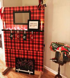 a red and black plaid christmas decoration with candles