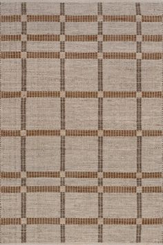 an area rug with brown and white squares on it