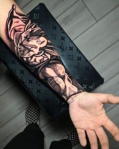 a person with a tattoo on their arm