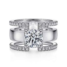 an 18k white gold engagement ring with two rows of pave set diamonds on each band