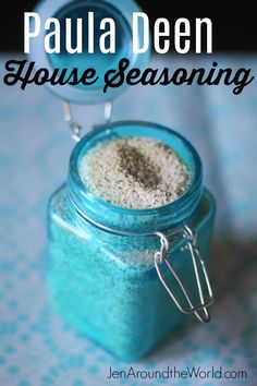 a blue jar filled with white powder on top of a table