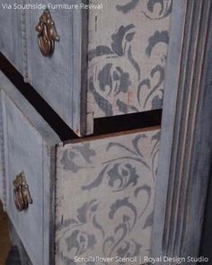 the drawers are painted with blue and white designs