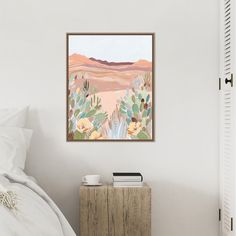 a painting hanging on the wall above a bed