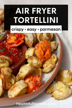 an air fryer tortelli with marinara sauce in a bowl on a table