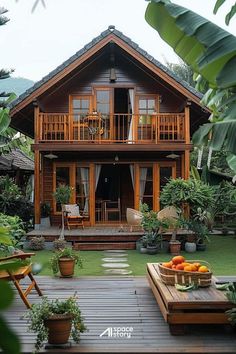 a wooden house surrounded by greenery and potted plants