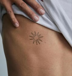 a person with a tattoo on their stomach