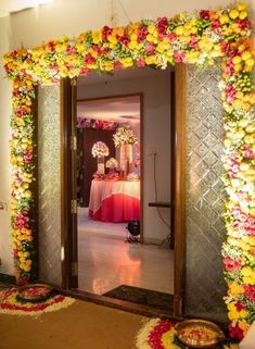 an entrance decorated with flowers and candles for a wedding or other special occasion to be attended