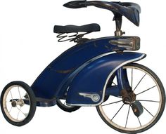 an old blue tricycle is shown against a white background