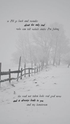 a snow covered field with a fence in the foreground and a poem written on it