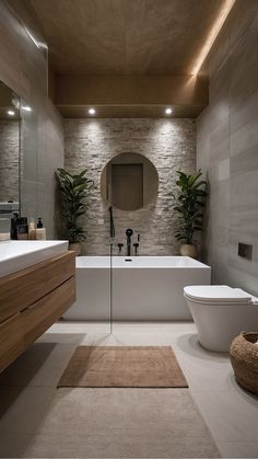 a bathroom with a bathtub, toilet and sink in it's center area