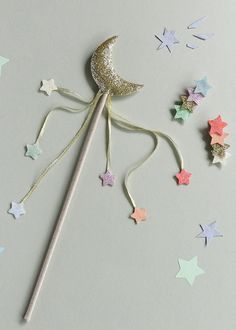 a wand with glitter stars and a moon on it