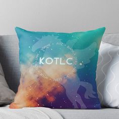 a colorful throw pillow with the words kotlc on it