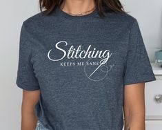 a woman wearing a t - shirt that says stitching keeps me sane on it