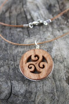 "This beautiful and unique hand-carved Triskelion pendant will be made for you, or a loved one, in my studio on the West of Ireland. Encircled with a Sterling silver ring into a side groove, this intricate carving features a piece of elm. Considered one of the sacred trees in the Celtic world, elm has often been associated with Mother and Earth Goddesses. In rural Ireland the elm tree was said to possess magical properties and was considered to be the home of the fairies. Found inscribed on mega Rural Ireland, Intricate Carving, Triple Spiral, Elm Tree, Sacred Tree, Celtic Necklace, Earth Goddess, Necklace Unique, Celtic Jewelry