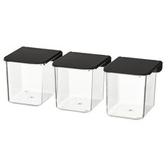 three clear containers with black lids on each side