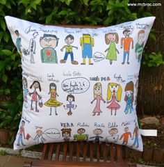 a pillow with cartoon characters on it sitting on a bench