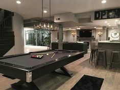 a pool table in the middle of a living room