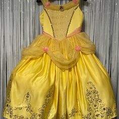 Disney Belle Premium Gown. Yellow With Gold And Pink Accents, Chiffon Sleeves And Full Skirt. Size Medium, 8-10. Yellow Princess Dress For Dress-up, Yellow Fitted Princess Dress For Dress-up, Fitted Yellow Princess Dress For Dress-up, Yellow Princess Dress For Costume Party, Yellow Princess Style Dress For Costume Party, Fitted Yellow Princess Dress For Fancy Dress, Disney Princess Dress For Dress-up, Yellow Sleeveless Princess Dress, Gown Yellow