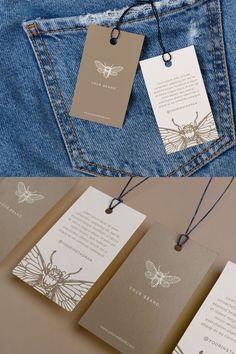 three tags hanging from the back pocket of a pair of blue jeans with an image of a butterfly on them