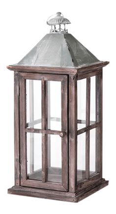 an old wooden lantern with glass panels and a metal roof on top, isolated against a white background