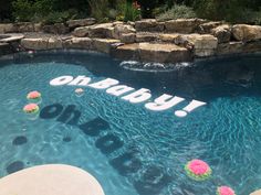 there is a pool with flowers in it and the word jumbo spelled out on the side