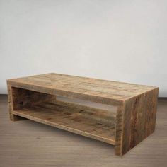 a wooden coffee table sitting on top of a hard wood floor