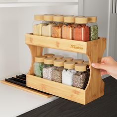 a bamboo spice rack holds spices and seasonings