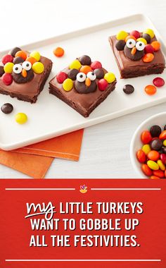 two heart shaped brownies decorated with chocolate candy and candies in the shape of a turkey