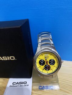 Title; Unused Rare Yellow Dial /Casio EF-307 Wrist Watch/Stainless Stell /  Men's Edifice 100 Meter/ Steel case/ Sporty and stylish/ Very Very Rare Color ✔️ ✈🎁 Fast shipping UPS Express (Europe 2-3 days) (America 3-5 days) (Australia 5-8 days) (Canada-4-8 days)      ⏰       Original Casio watch box is included. ⌚Style:Casual ⌚Dial Color:Rare YELLOW cOLOR ⌚ Manual/Booklet:Yes ⌚Depertmant:Men ⌚ Type:Wristwatch ⌚ Movement:Quartz ⌚Brand:Casio ⌚ Case Material:Stainless Steel ⌚ Closure:Buckle ⌚ Case Modern Yellow Chronograph Watch With Tachymeter, Yellow Chronograph Watch With Analog Display, Yellow Chronograph Watch, Yellow Analog Watch With Round Dial, Yellow Chronograph Watch With Tachymeter, Yellow Chronograph Watch For Formal Occasions, Yellow Watch Accessories With Tachymeter And Round Dial, Formal Yellow Chronograph Watch, Yellow Watch Accessories With Tachymeter