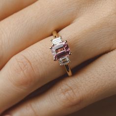 Our beautiful Bronte Pink Spinel Engagement Ring featuring a 1.3 ct Pink Spinel surrounded by 2x straight lab diamond baguettes. Specifications below: Centre Stone: 1.3 ct Pink Spinel measuring 7.3 x 5.6 mm Metal: 14 ct Yellow Gold Side Stones: 2 x straight lab diamond baguettes This ring is one of a kind and is available for purchase. Have something similar in mind? We can custom make to order to suit your choice of centre gemstone. Enquire today to explore our range of gemstones and to help cr Spinel Engagement Ring, Classic Gold Rings, Spinel Engagement Rings, Black Zirconium Ring, Sapphire Eternity Ring, Gemstone Engagement Ring, Diamond Signet Ring, Pink Spinel, Spinel Gemstone