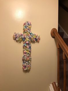 a cross made out of candy on the wall