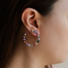 Indulge in the elegance of the Ivy Crescent Earrings in Multi-colored Sapphire by Ruchi New York. These stunning earrings are a true testament to Ruchi's dedication to fine craftsmanship and exquisite design. The mixed shape multi-colored sapphires add a modern radiance to the traditional crescent shape, making them perfect for any occasion. With 8.71 carats of multi-colored sapphire, these earrings are a true statement piece that will catch everyone's eye. Elevate your jewelry collection and tr Elegant Multi-stone Hoop Jewelry, Elegant Multi-stone Hoop Earrings, Fine Jewelry Multicolor Cubic Zirconia Earrings, Elegant Multicolor Earrings With Sparkling Stones, Multicolor Cubic Zirconia Fine Jewelry Earrings, Multicolor Cubic Zirconia Earrings Fine Jewelry, Luxury Multicolor Sterling Silver Earrings, Elegant Multicolor Gemstone Hoop Earrings, Elegant Multicolor Hoop Jewelry