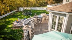 an aerial view of a backyard with patio furniture