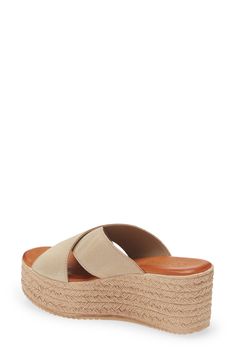 An espadrille-style wedge keeps your summery look classic in a slide sandal with suede straps that cross at the vamp. 2 3/4" heel; 1 3/4" platform (size 39) Cushioned footbed Leather upper/leather and textile or leather lining/synthetic sole Made in Spain Women's Shoes Platform Espadrille Slip-on Sandals, Slip-on Platform Wedge Espadrille Sandals, Summer Suede Slip-on Espadrilles, Comfortable Open Toe Platform Espadrilles, Comfortable Espadrille Wedge Heel Sandals, Casual Leather Wedge Sandals For Beach Season, Chic Summer Suede Espadrilles, Straw Slip-on Wedge Sandals For Vacation, Straw Slip-on Wedge Sandals