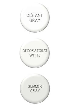 two white buttons that say, dictators'white and summer gray