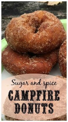 sugar and spice campfire donuts on a plate with the words, sugar and spice campfire donuts