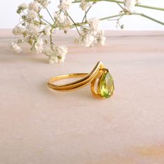 Natural Peridot, Pear Cut, 14k Solid Yellow Gold Ring JEWELRY INFORMATION MATERIAL: 14K Yellow Gold (Leave a message for pricing in 9k and 18k Gold) Stone: Natural Peridot Stone 1,1 CT Stone Cut: Pear Cut Stone Size: 8mm x 6mm Ring Finish: Polished For you or someone special... ########## LINKS ########## Follow the link for this Earring: https://www.etsy.com/listing/695217987 1. Follow the link for this Ring: https://www.etsy.com/listing/692202983 2. Follow the link for this Ring: https://www.e Yellow Gold Teardrop Ring For May Birthstone, Yellow Gold Teardrop May Birthstone Ring, Green Teardrop 14k Gold Ring, Pear-shaped Gold Emerald Ring, Yellow Gold Teardrop Ring With Birthstone, Gold Peridot Rings For Formal Occasions, Pear-shaped Yellow Gold Emerald Ring For Anniversary, Pear Shaped Emerald Ring In Yellow Gold For Anniversary, Pear-shaped Emerald Ring In Yellow Gold For Anniversary