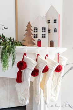 Get the scoop on how to use wooden houses for Christmas decorations with this Christmas mantel decor styling. #christmasmantel #christmasdecorations #christmasdecoratingideas #firstdayofhome Diy Wooden Houses, Ideas For Christmas Decorations, Christmas Red And White, Christmas Coffee Table Decor, Christmas Mantel Decor, For Christmas Decorations, Christmas Mantel, Christmas Mantel Decorations