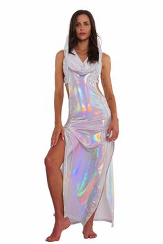 Step into the spotlight and unleash your inner goddess with the Atlantis holographic white maxi dress. Made with lightweight, prismatic spandex that gently hugs your curves and drapes beautifully, this dress shimmers and shines as you move, capturing everyone's attention. Whether you're dancing under the stars or soaking up the sun, this festival maxi dress is guaranteed to elevate your ethereal vibes. FEATURES: Maxi Length High side slits for ease of movement Cowl neck with voluminous hoodie Sl We Are Festival, White Maxi Dress, Rave Outfit, Inner Goddess, Streetwear Shop, Shimmer N Shine, White Maxi, Under The Stars, Rave Outfits