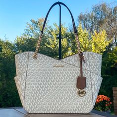 Michael Kors Jet Set Travel Large X Chain Shoulder Tote New With Tags Color: Vanilla Gold Tone Hardware Top Zip Closure Double Straps With Approx. 10” Drop Exterior: 1 Front Pocket Interior: 1 Zip Pocket And 2 Slip Pockets Approx. 15.6”Wx11”Hx5.5”D Michael Kors White Shoulder Bag With Chain Strap, Large Drawstring Bag, Large Tote Purse, Leather Tote Purse, Michael Kors Tote Bags, Red Tote, Mk Bags, Large Leather Tote, Gold Bag