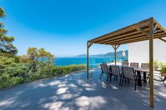 an outdoor dining area overlooking the ocean