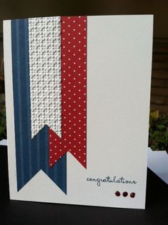 an congratulations card with red, white and blue ribbons