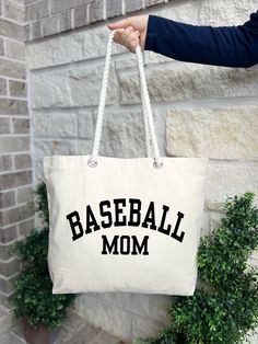 Baseball Mom Gifts, Baseball Mom Tote Bag, Baseball Mom Bag, Gift For Baseball Mom, Baseball Mom Bag, Baseball Team Mom Gift HOW TO ORDER: 1. Please, Check and Review all Photos.  2. Choose Your Quantity as much as you want. 3. Click "Add To Cart". For multiple items go back to the listing and repeat the steps. *DETAILS OF THE BAGS: 25L Tote Bag Measurements - 20"L x 15"H x 5"D 100% cotton , 26" rope handles, inside zippered flap pouch pocket. * PROCESSING & SHIPPING: Processing time is 1-2 days Sporty Rectangular Canvas Bag, White Letter Print Sports Bag, Sporty Rectangular Cotton Bag, Sporty Large Capacity Canvas Bag, Sporty White Canvas Bag For Daily Use, Sporty Letter Print Bags For Sports, Sporty Letter Print Sports Bag, Sporty Large Capacity Rectangular Canvas Bag, White Sporty Rectangular Canvas Bag