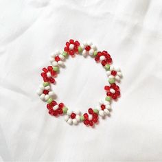 Stretchy Handmade Beaded Bracelet! Ditsy Flowers, Alternating Colors (Red, White & Green). Fits Best On Wrist Sizes 5.5-6.5”. Made With 3 Mm Plastic Seed Beads. This Is A Made-To-Order Listing! Your Bracelet May Differ Slightly From The One Photographed. Please Feel Free To Contact Me With Any Questions! Red Round Beads Bracelets For Summer, Red Beaded Bracelets For Summer, Handmade Red Beaded Bracelets For Summer, Red Bracelet With Colorful Beads For Summer, Stretchy Beaded Bracelet, Cowgirl Bling, Kandi Bracelets, Bohemian Handmade, Sterling Silver Bangle Bracelets